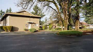 Lakewood apartment for rent - A building with a parking lot in front of it.