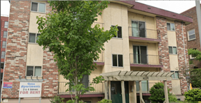 Seattle apartment for rent - Apartment building with a sign that says