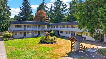 Lynnwood apartment for rent - A small building with a wooden post in front of it.