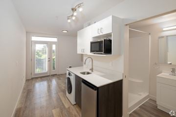 Seattle apartment for rent - A modern kitchen with a washer and dryer built in.