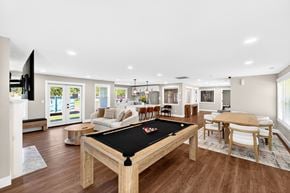 Lacey apartment for rent - A billiard table is in the middle of a well-furnished room.