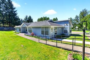 Lacey apartment for rent - A house with a grey roof and a fence in front of it.