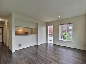 Seattle apartment for rent - Living room is open to the kitchen and dining room  at Charbonneau Apartments in Seattle, WA 98101
