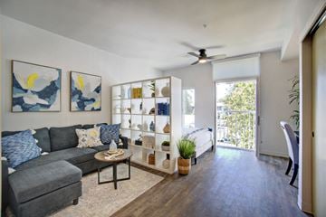 Lacey apartment for rent - A living room with a grey couch and a coffee table.