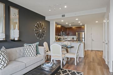 North Bethesda apartment for rent - a living room with a couch and a table and a kitchen