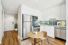 Philadelphia apartment for rent - A modern kitchen with a table and chairs.