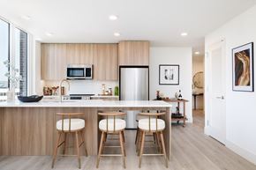 New Rochelle apartment for rent - A modern kitchen with a bar stool.