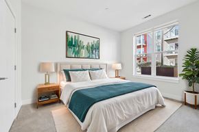 Everett apartment for rent - A bedroom with a large bed and a painting on the wall.