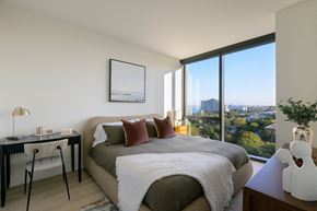 Philadelphia apartment for rent - a bedroom with a bed and a view of the city