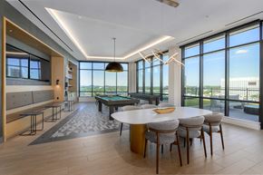 North Bethesda apartment for rent - A modern dining room with a large table and chairs.