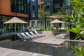 North Bethesda apartment for rent - Outdoor Courtyard with Lounge Chairs and Water feature at Arrowwood Apartments, North Bethesda