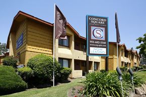 Riverside apartment for rent - A building with a sign that says Concord Square Apartment Homes.
