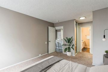 Garden Grove apartment for rent - A living room with a grey sofa and a grey rug.