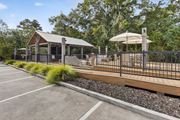 Mobile apartment for rent - A parking lot with a gazebo and a fence.