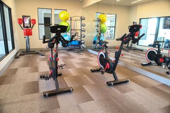 A gym with exercise bikes and other equipment