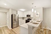 Oxford apartment for rent - a kitchen with a large island and stainless steel refrigerator at The Azul Apartment Homes in MS 38655