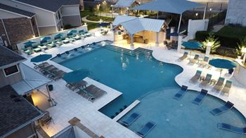 Pool and outdoor lounge amenity at parkwest apartment homes in hattiesburg mississippi