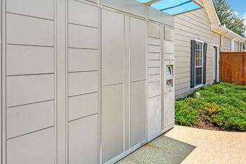 A row of garage doors in front of a house