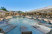 Starkville apartment for rent - the resort style pool with lounge chairs at the resort at governors residence at Crossgates Apartment Homes, Starkville