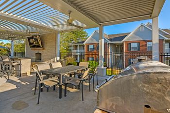 Outdoor lounge and grill and tv