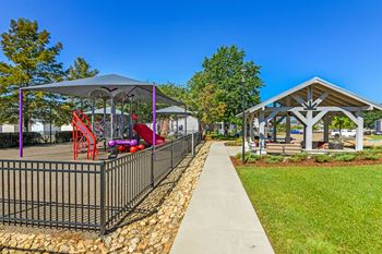 A playground with a slide and a gazebo