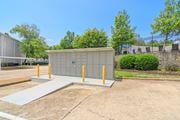 Oxford apartment for rent - a small building with yellow poles in a parking lot at Lexington Pointe Apartment Homes in Oxford, Mississippi 38655