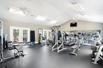 A spacious gym with a variety of equipment