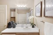Oxford apartment for rent - a bathroom with a sink and a mirror and a shower at Lexington Pointe Apartments in Oxford, MS 