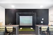 Oxford apartment for rent - Conference room with a table and chairs and a projector screen at Faulkner Flats Apartment Homes, Mississippi