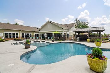 Swimming pool area with shaded chairs