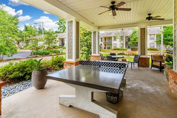  A covered patio with a ping pong table