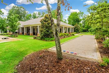 A house with a yard and a sidewalk in front of it