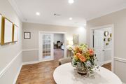 Mccomb apartment for rent - a dining room with a table and a vase with flowers at Parklane Apartment Homes, Mississippi, 39648