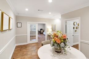 Mccomb apartment for rent - a dining room with a table and a vase with flowers at Parklane Apartment Homes, Mississippi, 39648