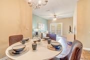 Olive Branch apartment for rent - a dining room with a table and chairs and a ceiling fan at The Vineyard of Olive Branch Apartment Homes, Mississippi 38654