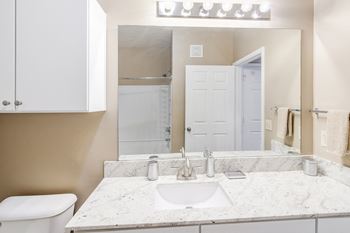 Bathroom with a granite countertop 