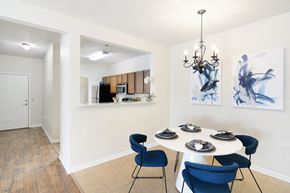 Bossier City apartment for rent - a dining room with a table and chairs and a chandelier at Landing Willow Bayou in Bossier City, LA