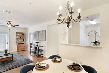 Bossier City apartment for rent - a living room with a dining room table and a chandelier