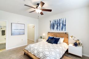 Bossier City apartment for rent - a bedroom with a bed and a ceiling fan at Landing Willow Bayou in Bossier City, LA