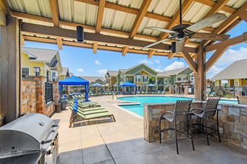 Grill area with relaxing area at pool