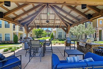 Outdoor grill with intimate seating area