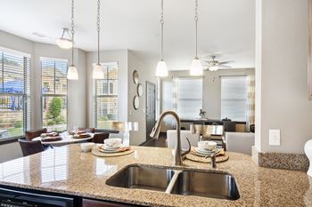 Modern kitchen with granite countertops and stainless steel appliances