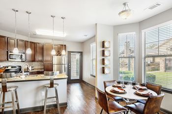 Equipped kitchen in clubhouse with dining area