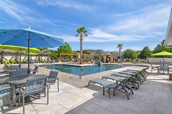 The swimming pool at the club at highland village apartments