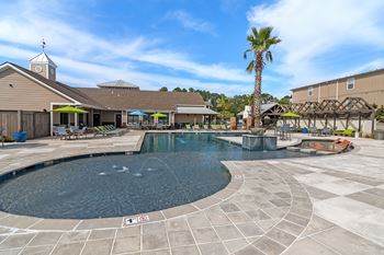 The swimming pool at the club at highland village apartments