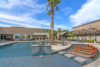 The swimming pool at the club at highland village apartments