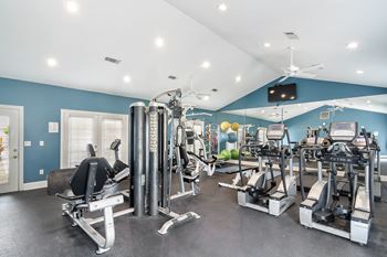The gym is equipped with state of the art equipment including cardio machines and weights