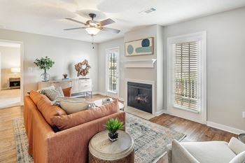 A living room with a couch and a fireplace