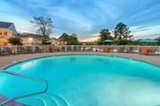 Gautier apartment for rent - our resort style swimming pool is open to the community and has a fence around it at The Pointe Apartment Homes in Gautier, Mississippi
