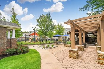 Covered outdoor lounge and grill entertaining area